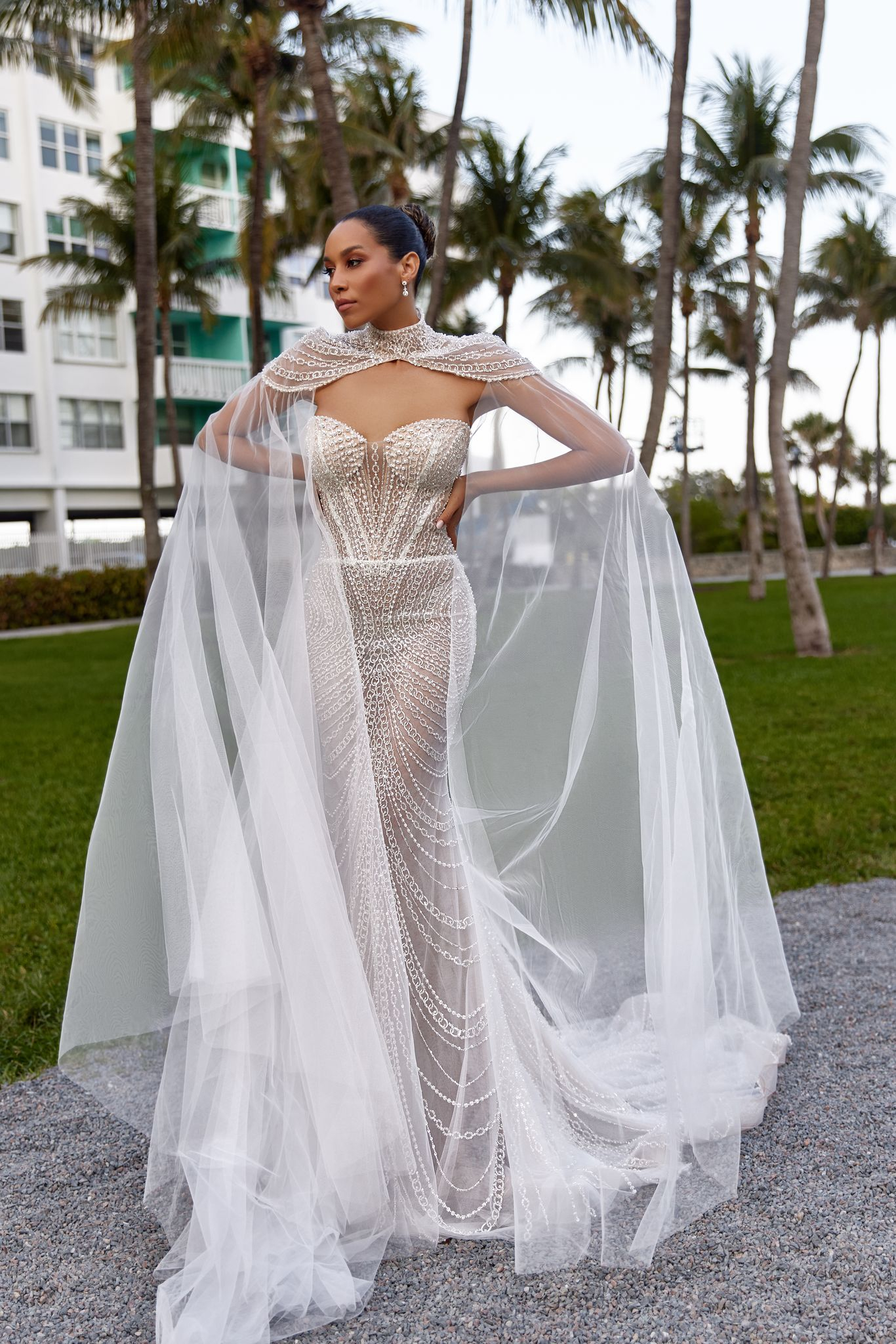 Elegant Aislin dress with delicate light, sheer accents and starry-night charm.