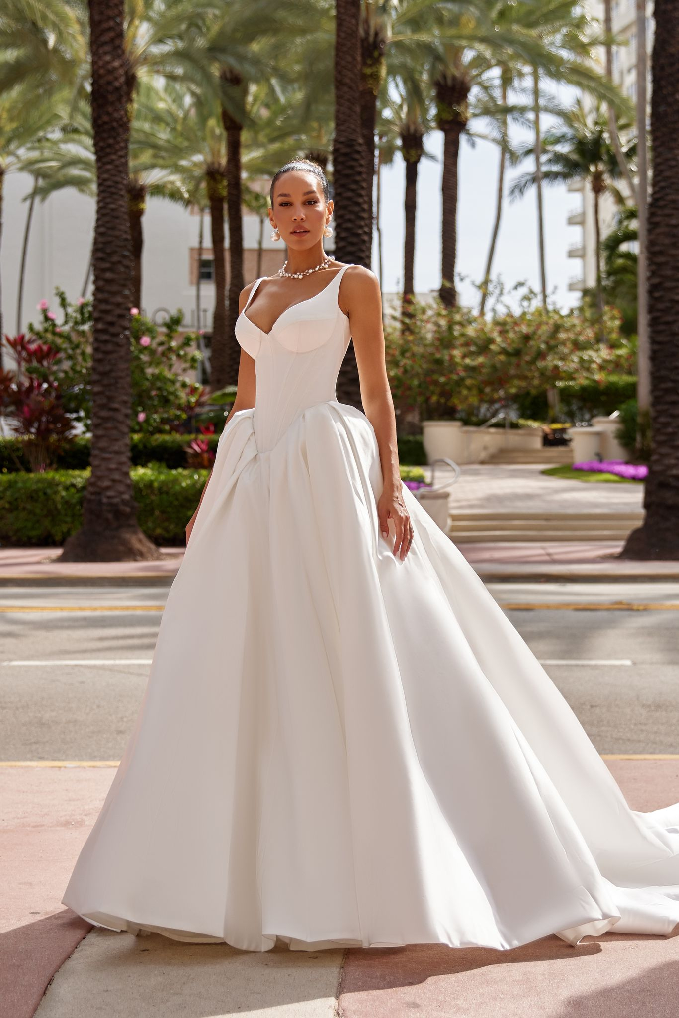 Karlyn off-the-shoulder wedding dress with voluminous skirt and elegant lacing.