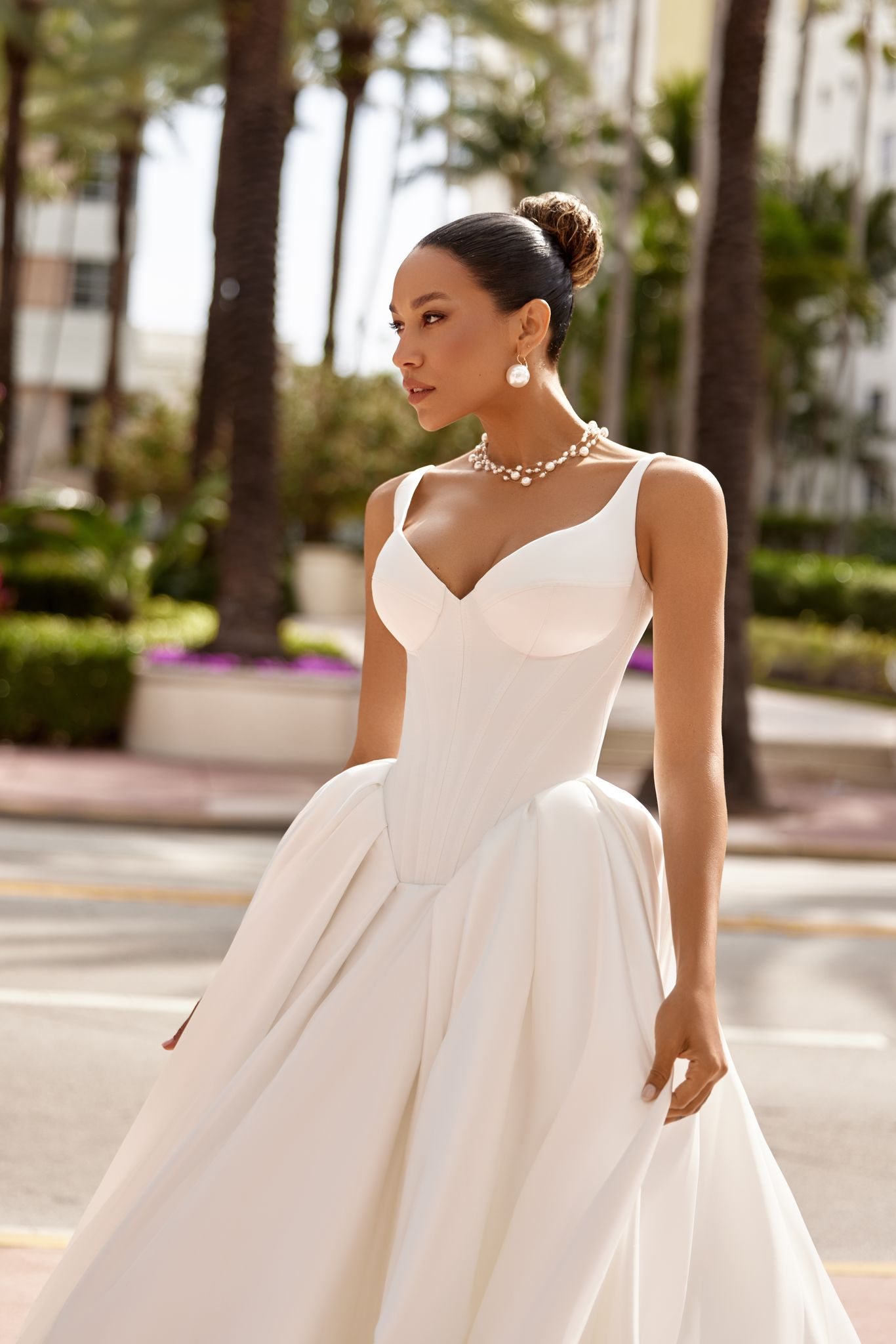 Timeless Karlyn bridal gown with cinched waist and noble matte fabric.