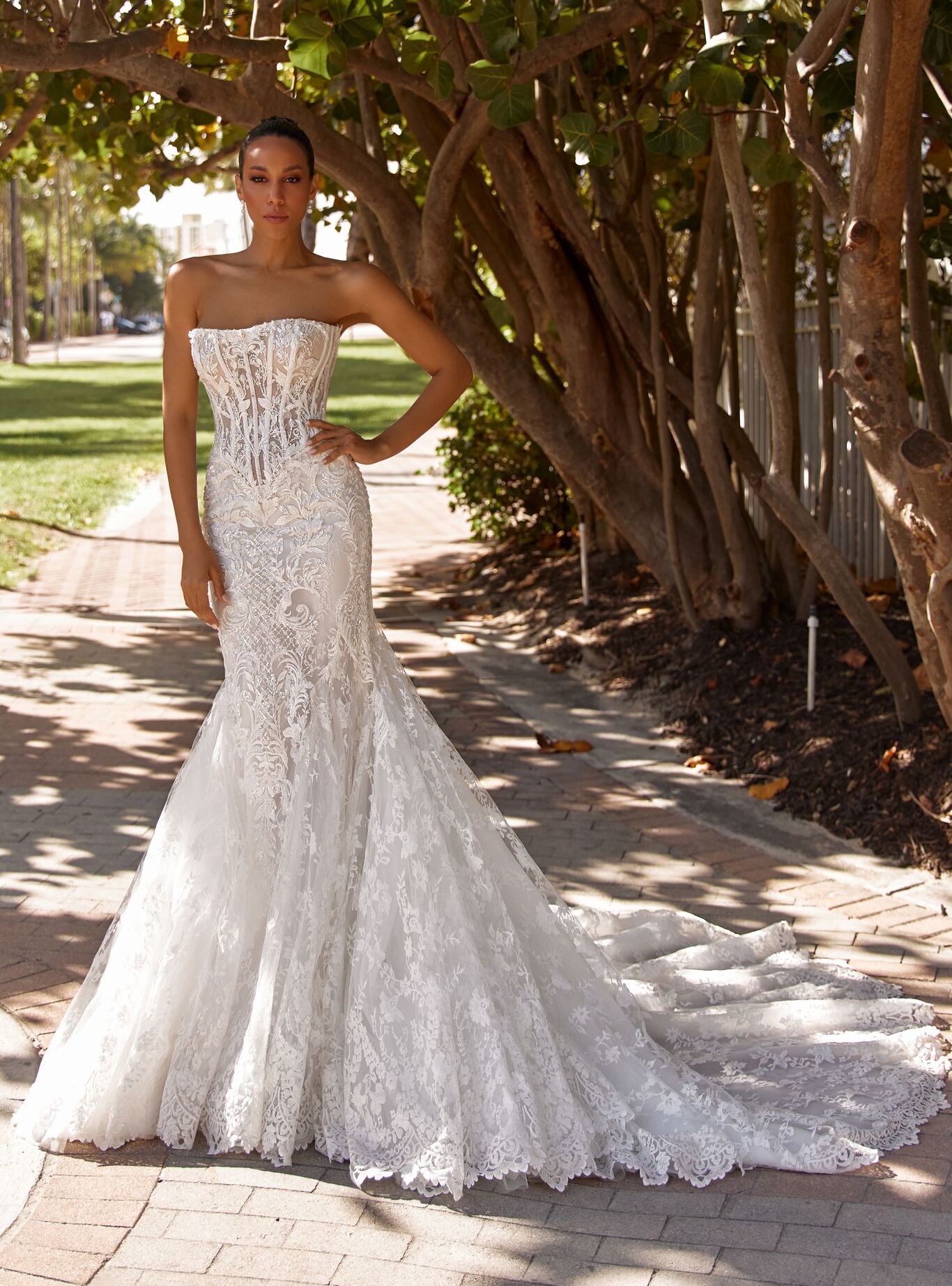 Amoret dress: flowing silhouette with pearls, crystals, and watercolor-like glow