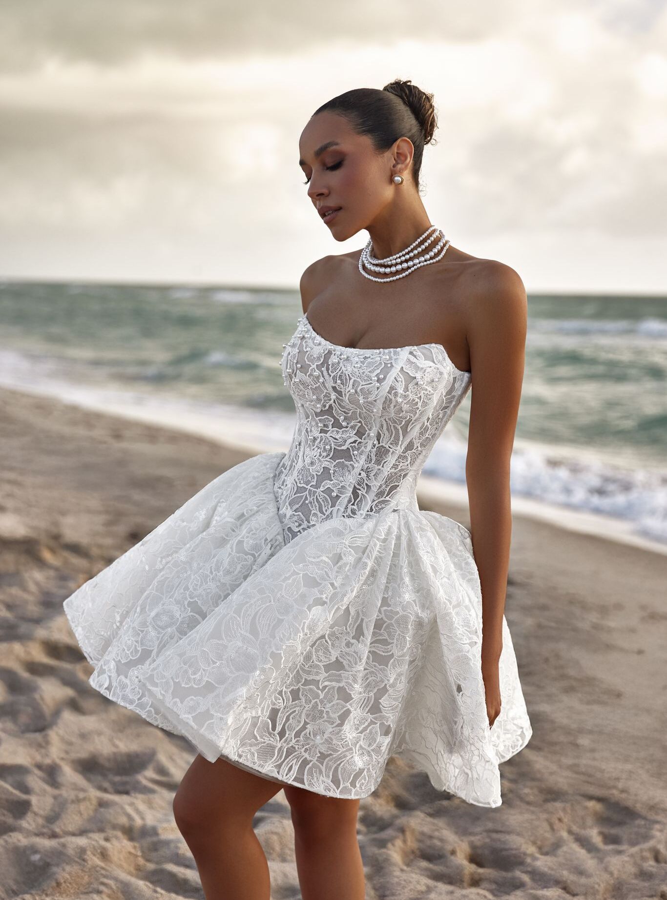 wedding dress Kylie by OKSANA MUKHA Kylie short wedding dress with structured corset, playful full skirt and pearl embroidery.