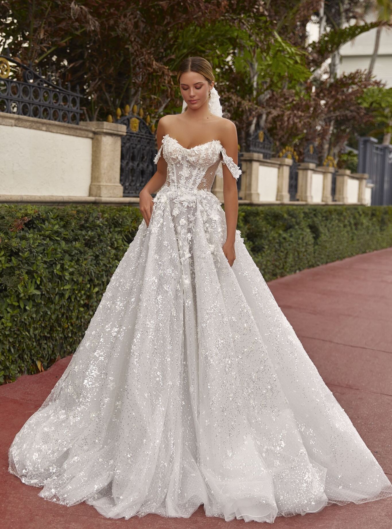 wedding dress Thalia by OKSANA MUKHA Thalia shimmering lace wedding dress with floral appliqués and soft elegant train.